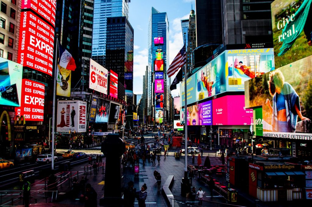 Times Square at dusk filled with billboards